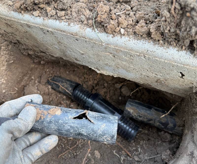 A cracked irrigation line a Sunlight tech dug up and replaced