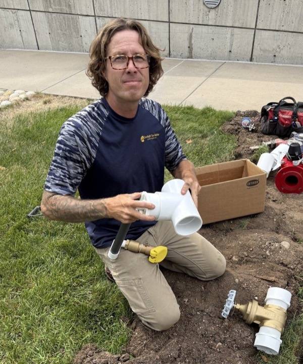 Shane Plummer installing a backflow assembly