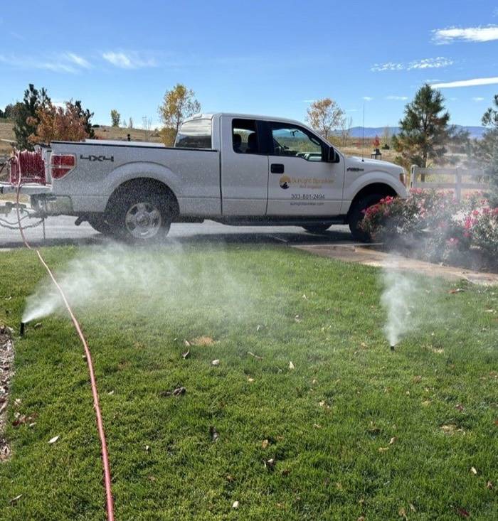 Sunlight truck mid-blowout in a driveway